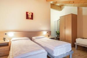Postel nebo postele na pokoji v ubytování Hotel Garnì Maria