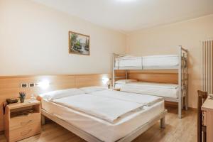 Postel nebo postele na pokoji v ubytování Hotel Garnì Maria