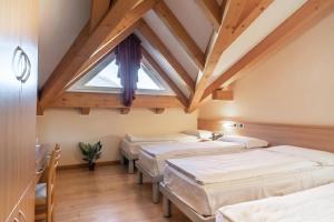 Postel nebo postele na pokoji v ubytování Hotel Garnì Maria