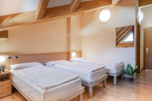 Postel nebo postele na pokoji v ubytování Hotel Garnì Maria