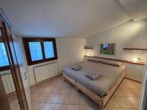 a bedroom with a large bed in a room at La Mansardina in Chioggia