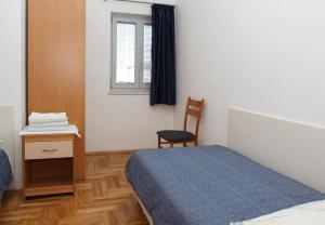 Ένα ή περισσότερα κρεβάτια σε δωμάτιο στο Apartments Mari