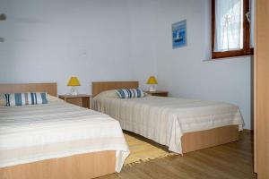 Posteľ alebo postele v izbe v ubytovaní Apartments Brane