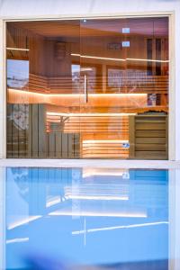 a view of a swimming pool in a house at Vila Borova Wellness&SPA Resort in Zlatibor