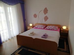 Katil atau katil-katil dalam bilik di Apartments Maca