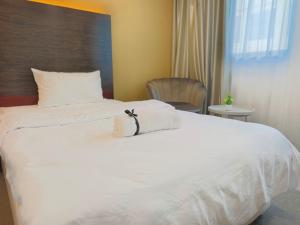 South China Sea Place by Kinabina Homestay客房内的一张或多张床位