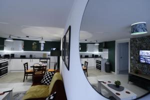 a view of a living room and kitchen from a mirror at listing SALE - Entire Town Centre Apartment Free Parking WiFi in Colchester +10 photos