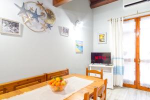 Μια τηλεόραση ή/και κέντρο ψυχαγωγίας στο CASA SUL MARE - SARDEGNA - FreeParking FreeWifi