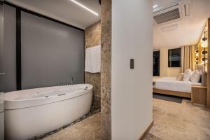 A bed or beds in a room at LIN Boutique Hotel by HOUSY HOST