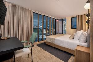 A bed or beds in a room at LIN Boutique Hotel by HOUSY HOST