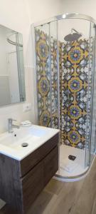 a bathroom with a shower and a white sink at San Peter Vatican City quiet and lovely apartment in Rome