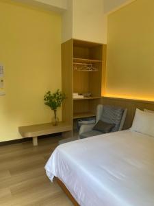 Postel nebo postele na pokoji v ubytování Orange Homestay