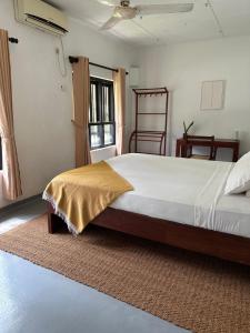 Postel nebo postele na pokoji v ubytování Mango Tree Villa