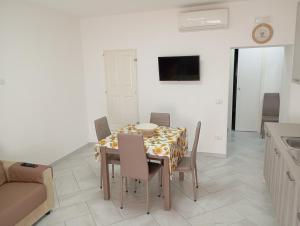 TV a/nebo společenská místnost v ubytování Borgo Family Suite