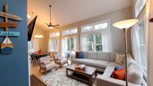 a living room with a couch and a table at Shore Thing in Union Pier
