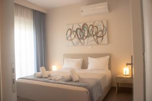Giường trong phòng chung tại Arfaras Home