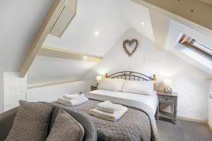 En eller flere senge i et værelse på Lobster Lodge - North East Escapes