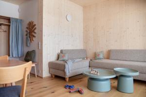 Posezení v ubytování biYou Ecoquartier in den Bergen