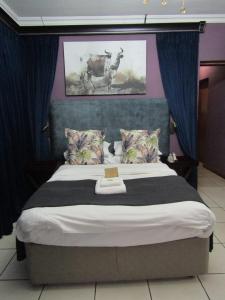 Postel nebo postele na pokoji v ubytování Kusile Guest House