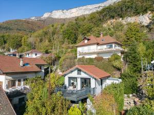 a large house on a hill with houses at Cottage Flottant - Vue Lac in Veyrier-du-Lac