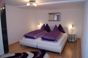 A bed or beds in a room at Haus Erika