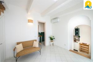 a living room with a couch and a table at Casa Angelie in Praiano