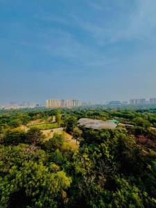 an overhead view of a park with tall buildings in the background at Parkview Escape 1BHK Penthouse In Kondapur in Hyderabad