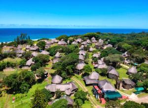 an aerial view of a village with a train at Hibberdene Cottage Crew in Hibberdene