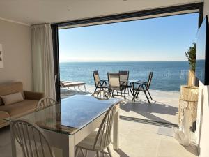 a living room with a view of the ocean at Seaside Resort in Trieste