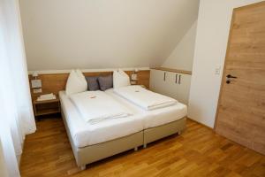 Postel nebo postele na pokoji v ubytování Athecada Apartments