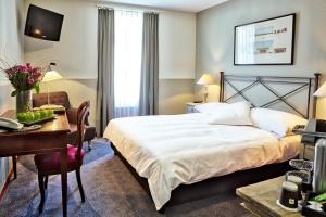 Ein Bett oder Betten in einem Zimmer der Unterkunft Hotel Montana Zürich