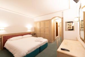 Postel nebo postele na pokoji v ubytování Chalet Stadio