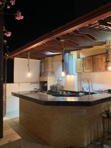 a kitchen with a large island in a room at Apartamento Duplex Cobertura in Belém