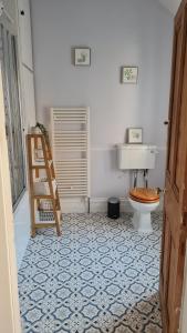 a bathroom with a toilet and a sink at Brylie House, Large Central family home in Skipton