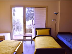 A bed or beds in a room at Rental rooms Antonella