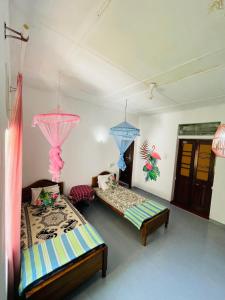 Postel nebo postele na pokoji v ubytování Casa Del Ceylon