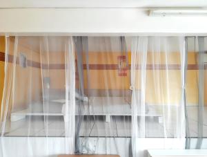 Ένα ή περισσότερα κρεβάτια σε δωμάτιο στο Studio confortable à Vieux Habitants 50 m² avec vue mer