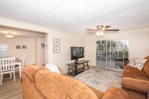 a living room with a couch and a table at Blue Heron House in Crawfordville
