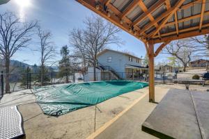 a basketball court with a green tarp on it at Hike, Boat, Fish and More Table Rock Lake Cottage in Cape Fair