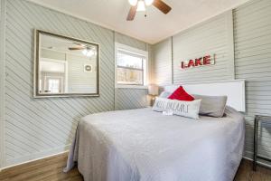 a bedroom with a bed and a mirror in it at Lake Views and On-Site Hiking Cape Fair Cottage in Cape Fair