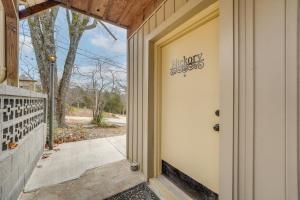 a door to a house with a sign on it at Lake and Trail Access Cape Fair Cottage with Deck in Cape Fair