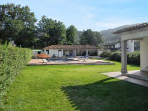 a view of a yard with a house at Welcoming villa in Santa Leocádia, private pool 475 m² in Feijoal