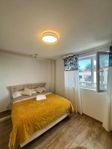 Postel nebo postele na pokoji v ubytování ARTu BEACH SUNSET Vv07860