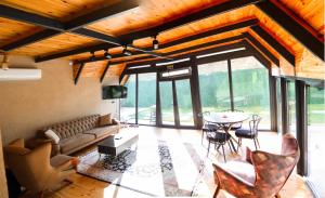 a living room with a couch and a table at Tina Bungalov in Sapanca