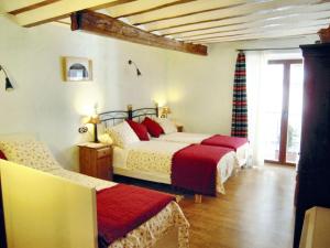 a bedroom with two beds with red pillows at Spacious House in Hornos with Mountain View in Hornos