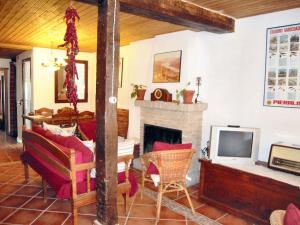 a living room with a fireplace and a tv at Spacious House in Hornos with Mountain View in Hornos
