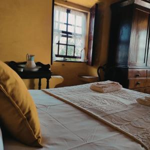 Een bed of bedden in een kamer bij Casas da Quinta da Cancela
