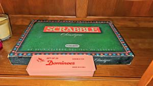 a cake for a game of scrabble on a table at Appartement spacieux aux Trois-Îlets avec piscine partagée in Les Trois-Îlets