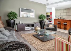 a living room with a couch and a table at Spacious villa in Santo Tirso with private pool 850 m² and jacuzzi in Santo Tirso