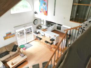 an overhead view of a living room and kitchen at Villa élégante à Château-la-Vallière avec piscine privée in Château-la-Vallière